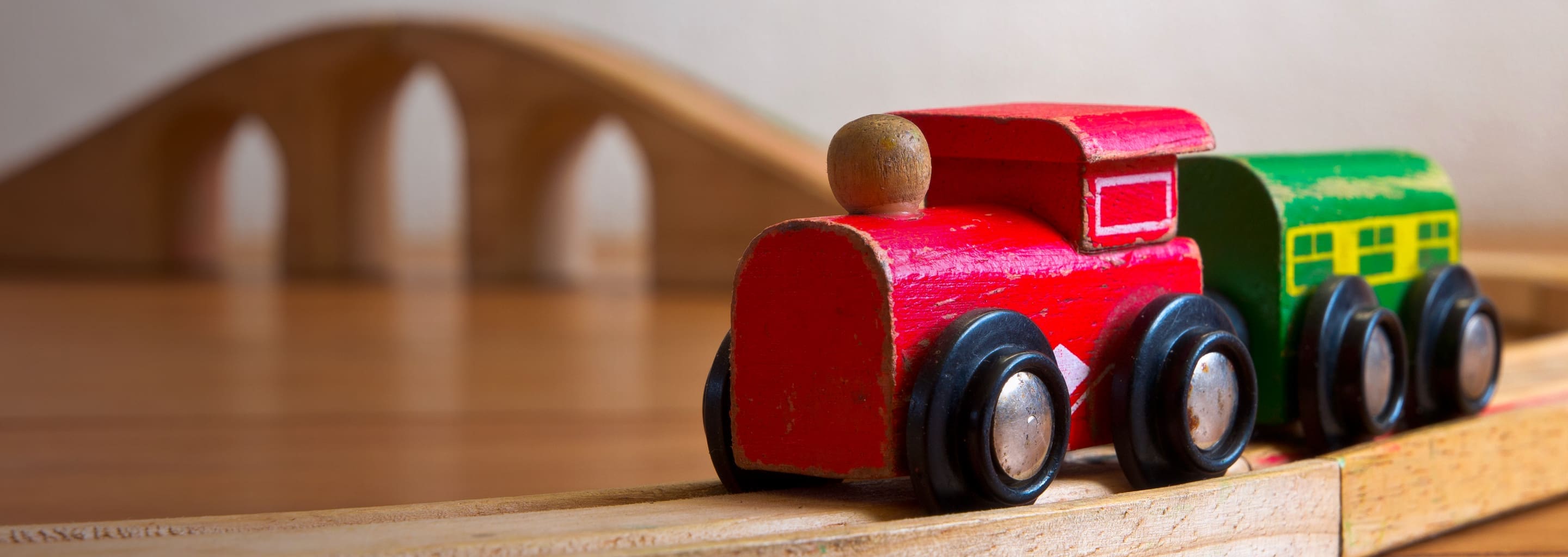 close up image of wooden to train on tracks