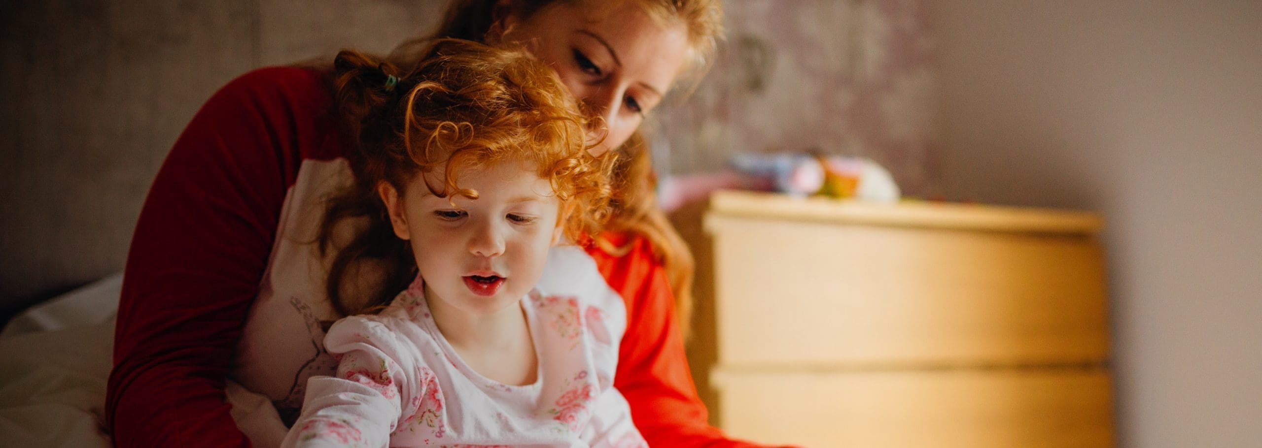 young girl and mother playing