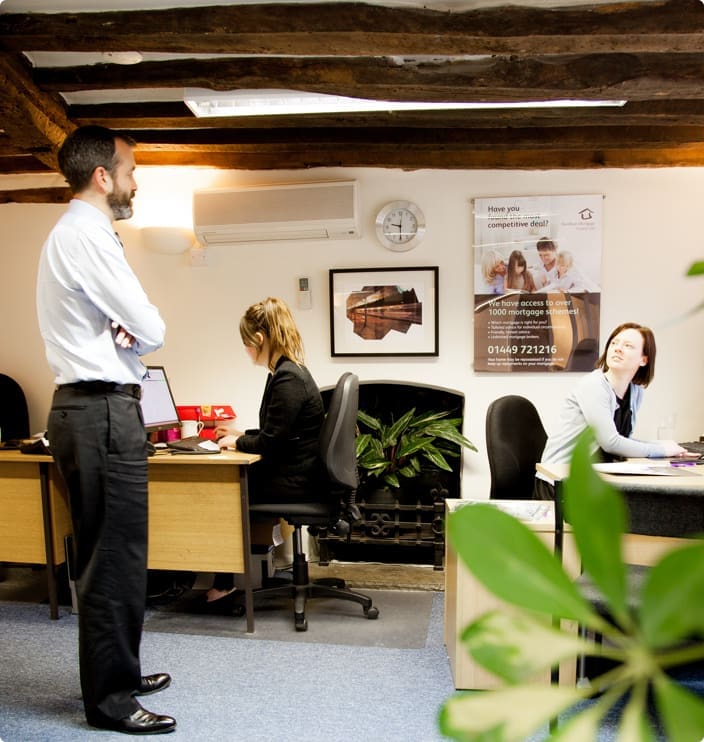 male and female having conversation in an office