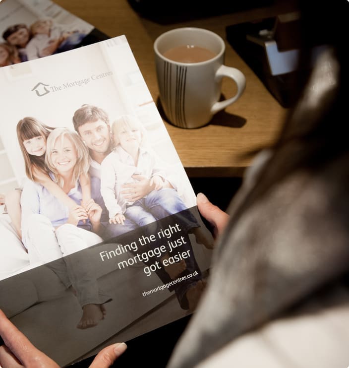 woman reading the mortgage centre magazine