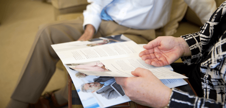 couple flicking through the mortgage centre magazine