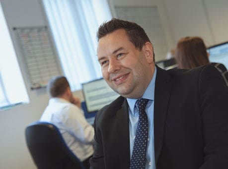 Man in suit smiling