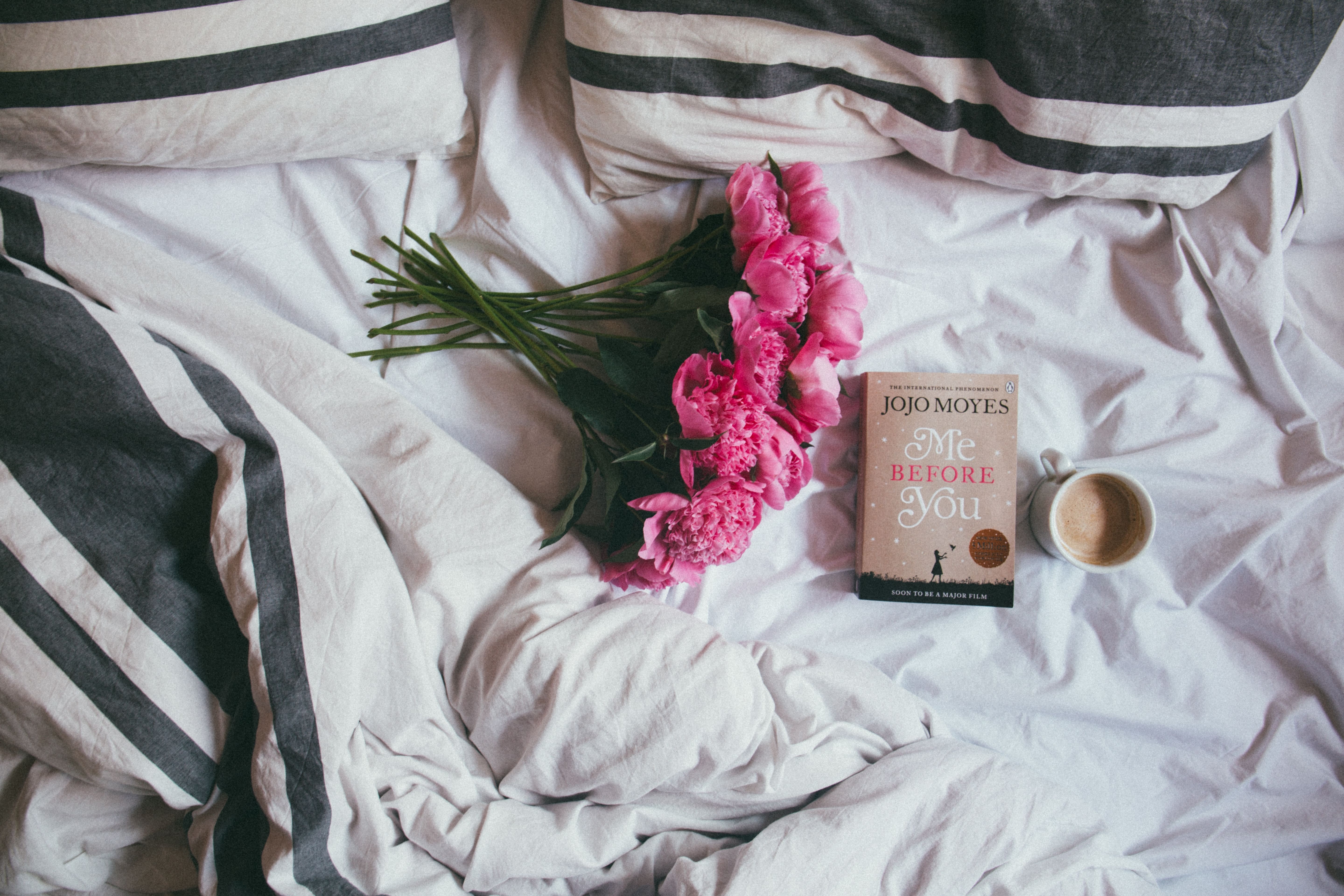 a bunch of flowers on a bed